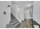 Bright foyer featuring a staircase, wood floors, and stylish decor at 5016 Kaslo Ave, Las Vegas, NV 89139