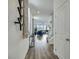 Hallway featuring wood floors, light gray walls, and stylish decor leading to the living spaces at 5016 Kaslo Ave, Las Vegas, NV 89139