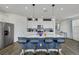 Open kitchen with stainless steel appliances, an island with bar seating, and pendant lighting at 5016 Kaslo Ave, Las Vegas, NV 89139