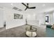 Cozy upstairs living area with a comfortable sofa, round glass table, and modern decor at 5016 Kaslo Ave, Las Vegas, NV 89139