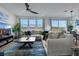 Spacious living room featuring a comfortable sectional sofa, stylish rug, and bright natural light at 5016 Kaslo Ave, Las Vegas, NV 89139