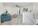 Upstairs living room area features plush carpet, neutral paint, and contemporary furnishings at 5016 Kaslo Ave, Las Vegas, NV 89139