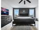Comfortable main bedroom with modern furnishings, large windows, and calming color scheme at 5016 Kaslo Ave, Las Vegas, NV 89139