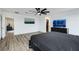 The spacious main bedroom features wood-look flooring and a ceiling fan at 5016 Kaslo Ave, Las Vegas, NV 89139