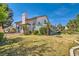 Spacious backyard with a covered patio and well-maintained lawn, offering ample space for outdoor activities and relaxation at 5044 Signal Dr, Las Vegas, NV 89130