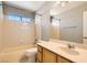 Bathroom showcasing a tub-shower combination, with a single sink vanity at 5044 Signal Dr, Las Vegas, NV 89130