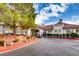 Clubhouse exterior with well-maintained landscaping and convenient parking at 5044 Signal Dr, Las Vegas, NV 89130