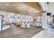 Large, well-lit dining room with elegant chandeliers and ample seating at 5044 Signal Dr, Las Vegas, NV 89130