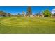 Expansive view of meticulously maintained golf course with vibrant green grass at 5044 Signal Dr, Las Vegas, NV 89130