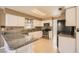 Bright kitchen with granite countertops, modern appliances, and ample cabinet space at 5044 Signal Dr, Las Vegas, NV 89130
