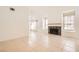 Living room featuring tile flooring, lots of natural light, and a beautiful fireplace at 5044 Signal Dr, Las Vegas, NV 89130