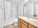 Bathroom featuring a shower-tub combo and vanity with sink at 5060 Blue Rose St, North Las Vegas, NV 89081