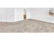 Comfortable bedroom features plush carpet and ample natural light, door to the bathroom at 5060 Blue Rose St, North Las Vegas, NV 89081