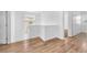 Bright hallway features beautiful wood floors, connecting various rooms in the house at 5060 Blue Rose St, North Las Vegas, NV 89081