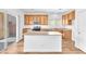 Bright kitchen featuring an island, wood cabinets, and stainless steel appliances at 5060 Blue Rose St, North Las Vegas, NV 89081