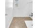 Laundry room with tile flooring, shelving, and access to utility connections at 5060 Blue Rose St, North Las Vegas, NV 89081