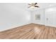 Bright living room with hardwood floors, a ceiling fan, and a window at 5060 Blue Rose St, North Las Vegas, NV 89081