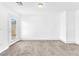 Spacious carpeted living room with neutral walls and recessed lighting at 5060 Blue Rose St, North Las Vegas, NV 89081