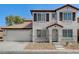 Charming two-story home featuring a two-car garage and well-maintained front yard landscaping at 5216 Aztec Heights St, North Las Vegas, NV 89081