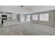 Bright, open-concept living space with recessed lighting, ceiling fan and sliding glass door to backyard at 5216 Aztec Heights St, North Las Vegas, NV 89081