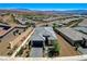 Stunning aerial view of a single-Gathering home showcasing the beautifully landscaped front yard and surrounding community at 54 Mirage View Dr, Henderson, NV 89011