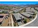 Stunning aerial view of a modern home in a scenic community with lake and mountain views at 54 Mirage View Dr, Henderson, NV 89011