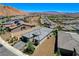 Aerial view of modern home with desert landscape, pavers, mountain views and modern architecture at 54 Mirage View Dr, Henderson, NV 89011
