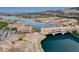 Gorgeous aerial view of Lake Las Vegas showcasing waterfront buildings, bridge, and scenic landscape at 54 Mirage View Dr, Henderson, NV 89011