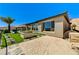 Backyard boasts artificial turf, desert landscaping, sandbox, and comfortable egg chair at 54 Mirage View Dr, Henderson, NV 89011