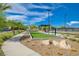Recreational bocce ball court with green turf and surrounding landscaping in a community setting at 54 Mirage View Dr, Henderson, NV 89011