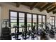 Well-equipped gym featuring state-of-the-art exercise equipment and scenic golf course views at 54 Mirage View Dr, Henderson, NV 89011