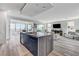 Spacious kitchen island overlooks a living area, dining area and mountain views at 54 Mirage View Dr, Henderson, NV 89011