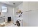 Bright laundry room with modern appliances and storage at 54 Mirage View Dr, Henderson, NV 89011