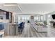 Open-plan kitchen and living area with an island, seating, and expansive views at 54 Mirage View Dr, Henderson, NV 89011