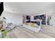 Open-concept living room with a modern kitchen featuring blue cabinets and a large central island at 54 Mirage View Dr, Henderson, NV 89011