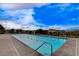 Long outdoor pool with dividing ropes in a community with a mountain view backdrop at 54 Mirage View Dr, Henderson, NV 89011