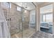 Contemporary bathroom featuring a large glass enclosed shower with showerhead and tile surround at 54 Mirage View Dr, Henderson, NV 89011