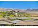 Luxury home in a desert community with mountain views, accented by modern architectural design and native landscaping at 54 Mirage View Dr, Henderson, NV 89011