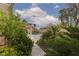 Lush backyard featuring a walkway, manicured landscaping, and a glimpse of a pool at 5404 Ireland St, Las Vegas, NV 89149