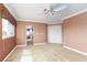 This bedroom has crown molding, ceiling fan, and large windows at 5404 Ireland St, Las Vegas, NV 89149