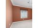 Empty bedroom with plush carpeting, crown molding, and a window at 5404 Ireland St, Las Vegas, NV 89149