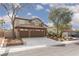 Beautiful two-story home showcasing a three-car garage, tile roof and well-manicured landscaping, in a great neighborhood at 5404 Ireland St, Las Vegas, NV 89149