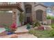 The front entrance features a secure ornamental metal gate and a beautifully manicured stone walkway at 5404 Ireland St, Las Vegas, NV 89149