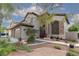 Charming home exterior with well-maintained landscaping and beautiful stone accents, creating great curb appeal at 5404 Ireland St, Las Vegas, NV 89149