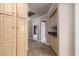 Hallway with storage cabinets, tan walls and carpeting at 5404 Ireland St, Las Vegas, NV 89149