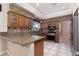 Gourmet kitchen featuring granite countertops, stainless steel appliances, and custom cabinetry at 5404 Ireland St, Las Vegas, NV 89149