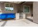 This outdoor kitchen features a stainless steel BBQ, convenient counter space, and a cozy seating area for easy entertaining at 5404 Ireland St, Las Vegas, NV 89149