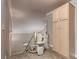 Accessibility-friendly staircase with chair lift and upper storage cabinet at 5404 Ireland St, Las Vegas, NV 89149