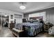 Cozy bedroom featuring dark wood floors, a plush bed, and ample natural light at 5424 Neosho St, Las Vegas, NV 89120