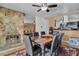 Cozy dining area with a stone fireplace and adjacent to the kitchen, ideal for gatherings and comfortable dining at 5424 Neosho St, Las Vegas, NV 89120